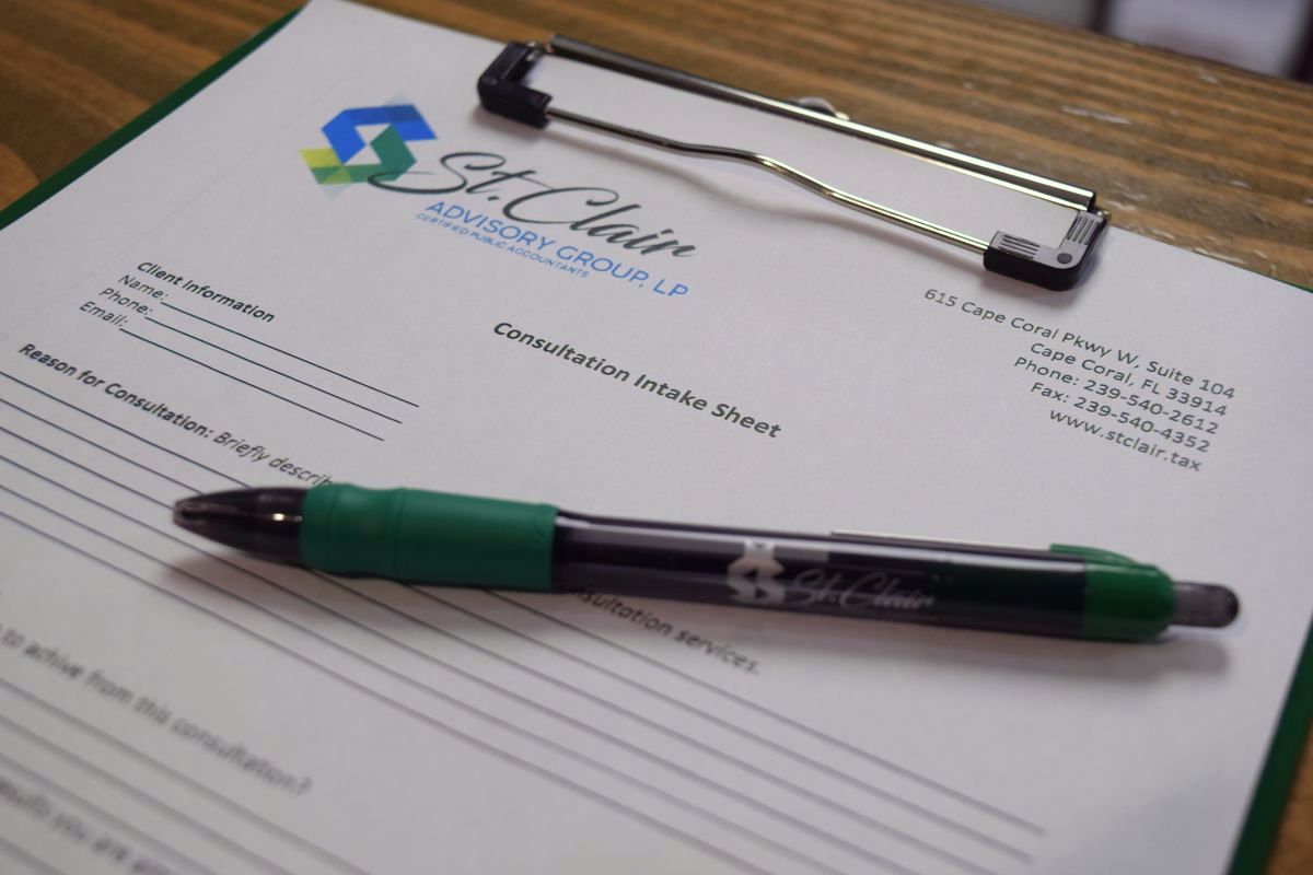 St. Clair consultation intake sheet on a clipboard