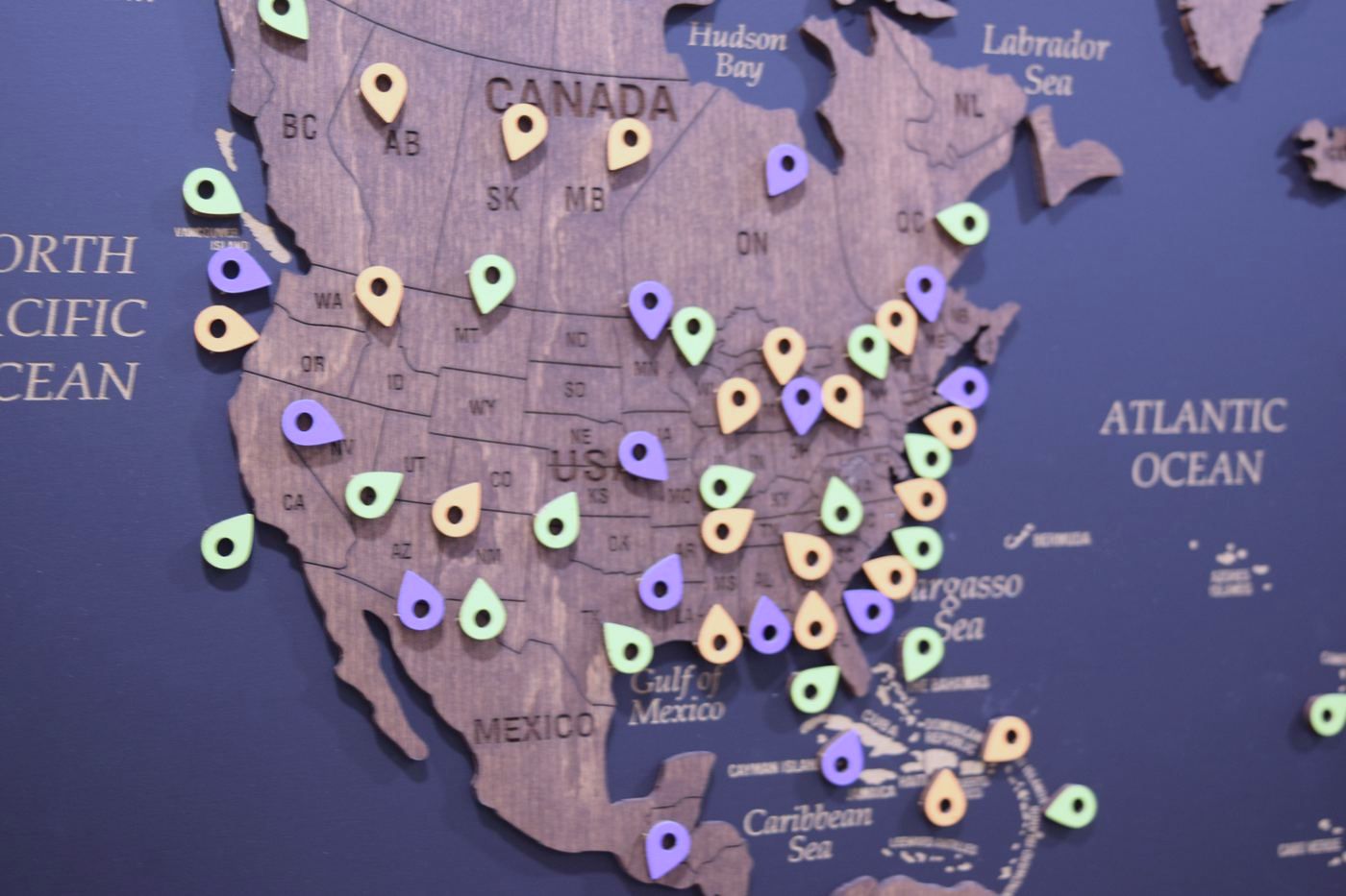 Client pins across North America on the St. Clair office world map