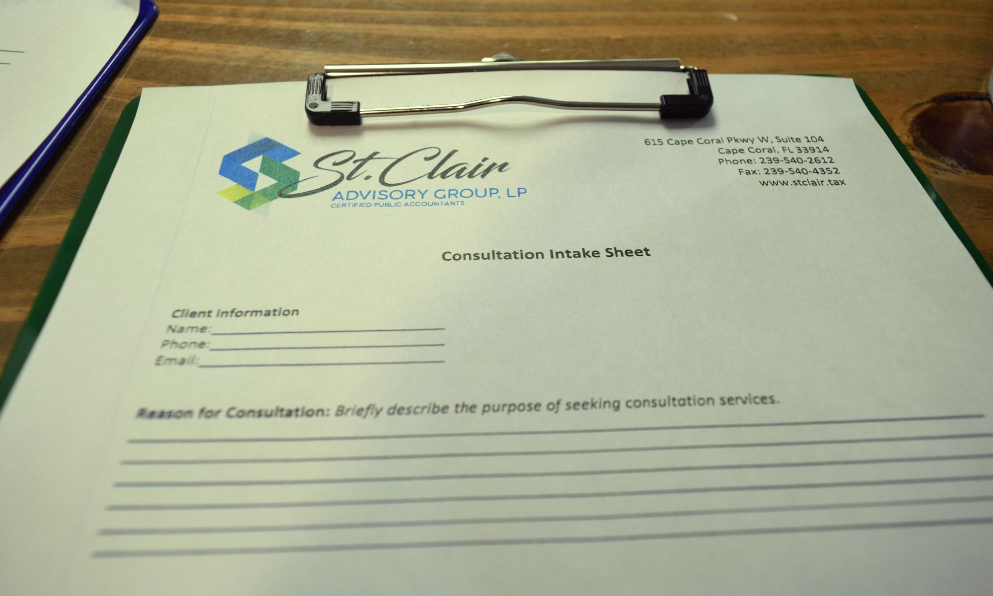 St. Clair consultation intake sheet on a clipboard