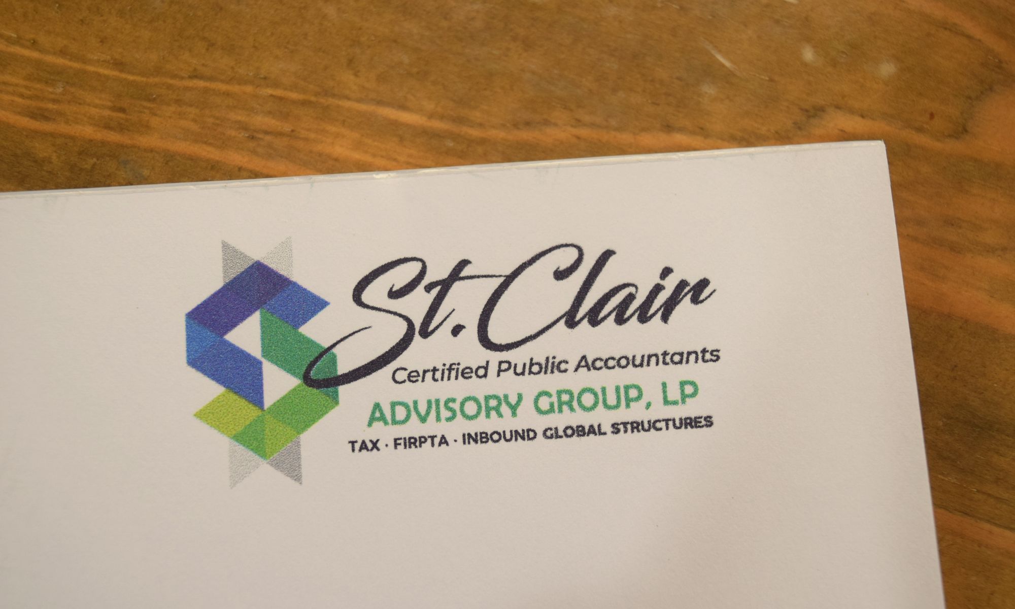 St. Clair letterhead on a wood desk