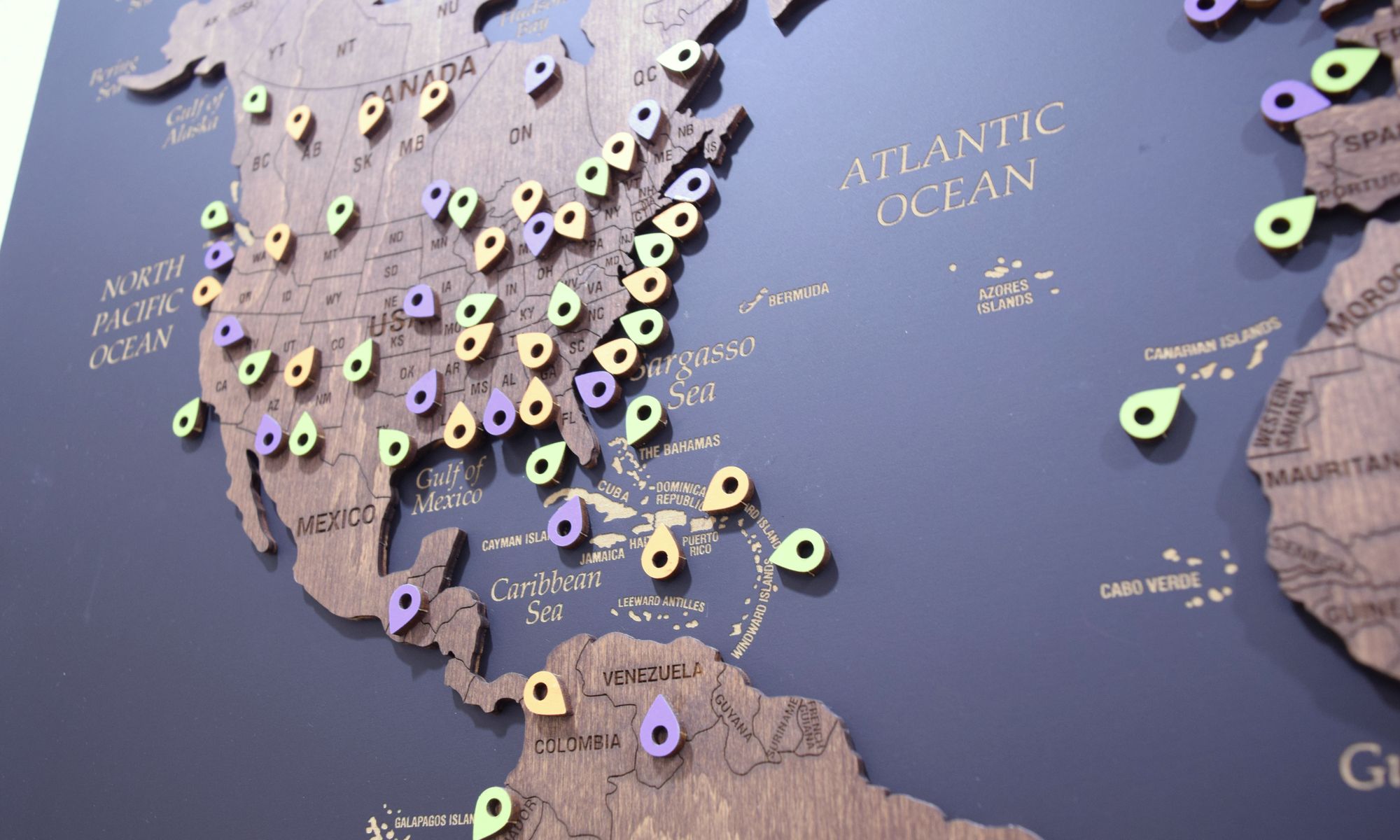 Client pins across the Americas and Europe on the office map