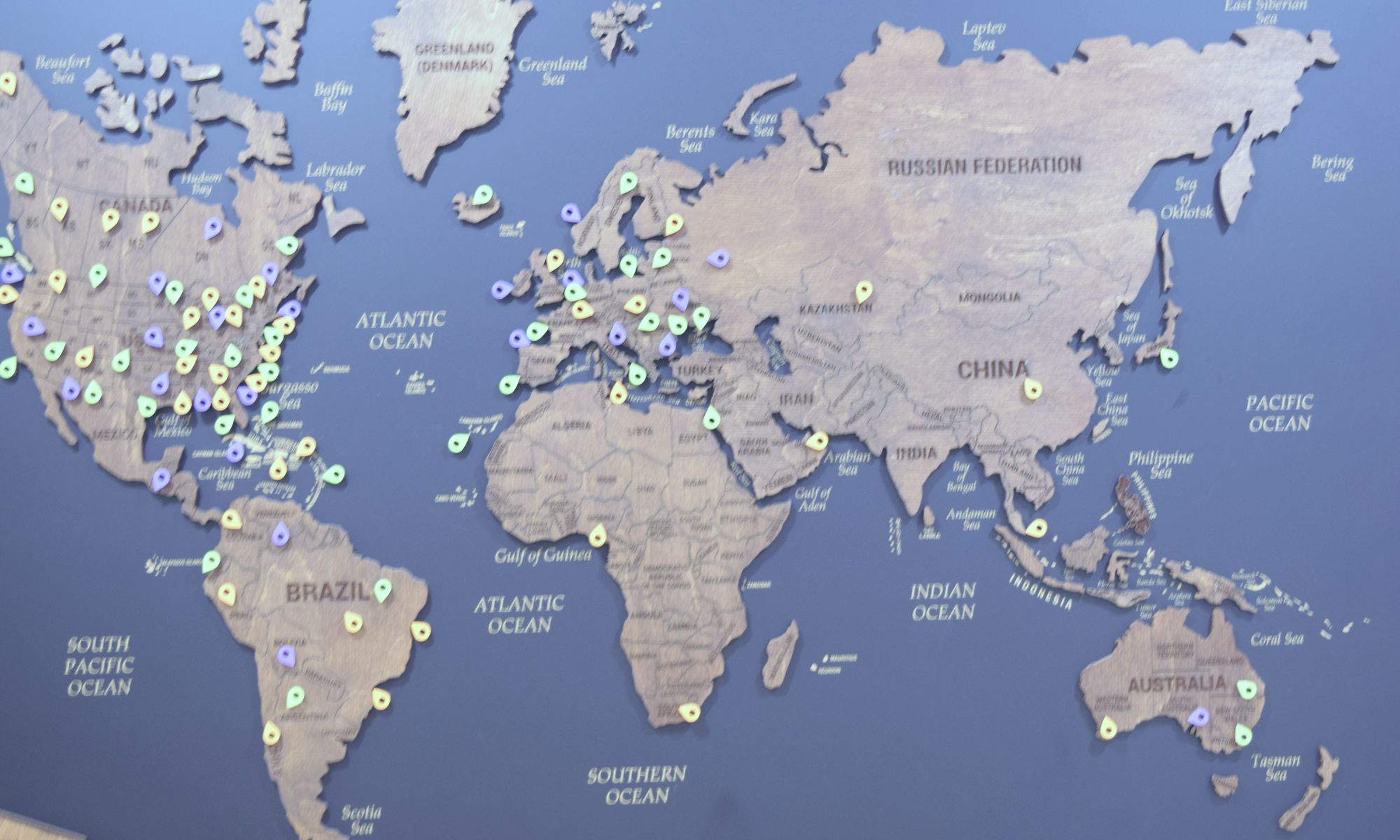 The St. Clair office world map with pins for clients around the globe