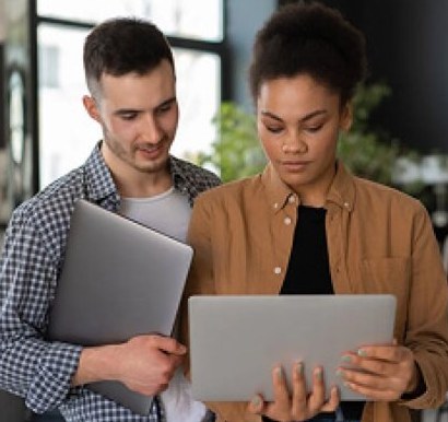 Two business owners reviewing their numbers on a tablet
