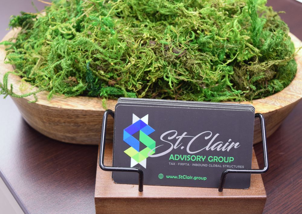 St. Clair business card on a moss centerpiece