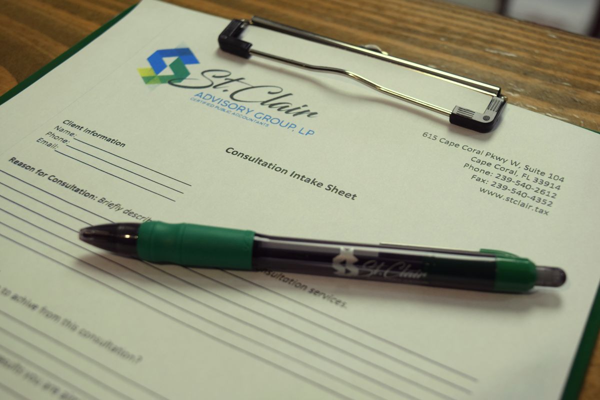 St. Clair consultation intake sheet on a clipboard